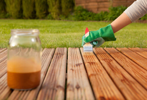 Applying decking oil with a brush